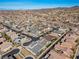 Expansive aerial view of a residential neighborhood with desert landscaping, modern homes and mountain views at 3025 Merlesco Ave, Henderson, NV 89044