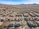 Panoramic aerial view of a community featuring modern homes, desert landscaping, and mountain backdrops at 3025 Merlesco Ave, Henderson, NV 89044