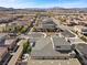 Aerial view of a community with a home that features a backyard with a play set and outdoor kitchen at 3025 Merlesco Ave, Henderson, NV 89044