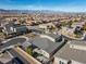 Expansive aerial view of a modern home featuring a landscaped backyard, mountain views, and a well-planned community at 3025 Merlesco Ave, Henderson, NV 89044