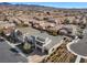 Aerial perspective of a modern two-story home with desert landscaping, mountain views, and neighborhood streets at 3025 Merlesco Ave, Henderson, NV 89044