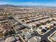 Scenic aerial view of a suburban neighborhood highlighting modern homes, landscaped streets, and mountain views at 3025 Merlesco Ave, Henderson, NV 89044