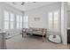 Light-filled ' bedroom with white shutters, a bunk bed, and neutral carpet at 3025 Merlesco Ave, Henderson, NV 89044