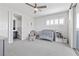 Cozy bedroom featuring a crib, chair, and bookshelf next to sliding glass doors at 3025 Merlesco Ave, Henderson, NV 89044