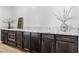 Counter space featuring stainless steel appliances, sleek countertops, and ample dark wood cabinet storage at 3025 Merlesco Ave, Henderson, NV 89044