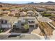 Contemporary home with a multi-car garage, desert landscaping, and mountain views in the distance at 3025 Merlesco Ave, Henderson, NV 89044