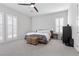 This spacious main bedroom features a ceiling fan, window shutters, and lots of natural light at 3025 Merlesco Ave, Henderson, NV 89044