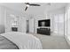 This main bedroom features a ceiling fan, closet, and a view into the main bathroom at 3025 Merlesco Ave, Henderson, NV 89044