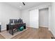 Home office with dark desk, wood floors, a sliding door, and natural lighting at 3025 Merlesco Ave, Henderson, NV 89044