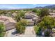 Aerial view of a lovely home and community, showcasing mature trees and well-kept lawns at 306 Treehouse Ct, Henderson, NV 89012