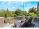 Cozy balcony with wicker furniture and peaceful outdoor views at 306 Treehouse Ct, Henderson, NV 89012