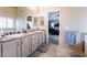 Spacious bathroom with a large vanity, bathtub, and adjoining bedroom at 306 Treehouse Ct, Henderson, NV 89012