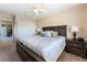 Bedroom with a large bed, ceiling fan and mirrored closet doors at 306 Treehouse Ct, Henderson, NV 89012