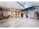 Spacious garage with ample storage cabinets and epoxy flooring at 306 Treehouse Ct, Henderson, NV 89012