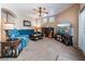 Cozy living room with comfortable seating and a large TV at 306 Treehouse Ct, Henderson, NV 89012