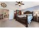 Spacious main bedroom with wall decor, and dark wood furnishings at 306 Treehouse Ct, Henderson, NV 89012