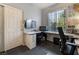 Cozy office space featuring a built-in desk and storage with natural light streaming through the window at 306 Treehouse Ct, Henderson, NV 89012