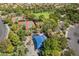 Aerial view of neighborhood park featuring tennis courts, playground, and covered picnic tables at 306 Treehouse Ct, Henderson, NV 89012