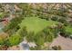 Park featuring a grassy field, playground, and tennis courts for neighborhood families at 306 Treehouse Ct, Henderson, NV 89012