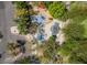 Aerial image of the community playground which includes slides and swing sets, plus covered tables at 306 Treehouse Ct, Henderson, NV 89012