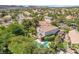 Aerial view of the home's backyard showcasing a private balcony with outdoor furniture, and pool at 306 Treehouse Ct, Henderson, NV 89012