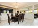 Elegant dining room featuring a chandelier, wood table with seating for six, and an open layout at 3163 Biccari Ave, Henderson, NV 89044