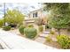 Beautiful two-story home featuring landscaped front yard, complemented by lush trees providing shade and privacy at 3163 Biccari Ave, Henderson, NV 89044