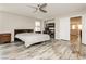 Spacious main bedroom with wood-look floors, ceiling fan, and closet at 3163 Biccari Ave, Henderson, NV 89044