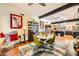 Open-concept dining area with hardwood floors and a seamless flow into the kitchen, perfect for modern living at 3212 Sundown Dr, Las Vegas, NV 89169