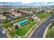 Stunning aerial view of the community pool, playground, and lush landscaping, perfect for Gathering living at 387 Layla Bay St, Henderson, NV 89014