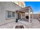 Inviting back patio featuring a cozy fire pit, heater, and shaded pergola, perfect for outdoor entertaining at 387 Layla Bay St, Henderson, NV 89014