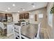 Bright dining area with view of kitchen, stainless appliances, and view to living room at 387 Layla Bay St, Henderson, NV 89014