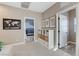 Upstairs hallway offering access to multiple rooms, featuring a neutral color palette at 387 Layla Bay St, Henderson, NV 89014