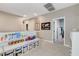 Upstairs hallway featuring open doorways and playful decor with built-in storage at 387 Layla Bay St, Henderson, NV 89014