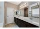 Bright main bathroom featuring a large vanity with dual sinks, modern fixtures, and a decorative mirror at 387 Layla Bay St, Henderson, NV 89014