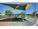 Neighborhood playground with shade structure, slides, and climbing structures at 387 Layla Bay St, Henderson, NV 89014