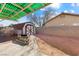 Landscaped backyard showcases a shed and potential for outdoor activities under a pergola at 3910 Cheryl Clay Way, North Las Vegas, NV 89032