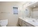 This bathroom features dual sinks, white cabinets and granite countertops at 3910 Cheryl Clay Way, North Las Vegas, NV 89032