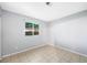 Bright bedroom features tile floors, a window, and neutral paint, ready for personalization at 3910 Cheryl Clay Way, North Las Vegas, NV 89032