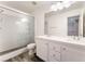 Bathroom featuring a walk-in shower, double sink vanity, and a large mirror at 4133 Perfect Lure St, Las Vegas, NV 89129