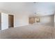 Spacious bonus room with neutral carpeting and stairway access at 4133 Perfect Lure St, Las Vegas, NV 89129