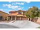 Inviting two-story home boasts a red tile roof, desert landscaping, and a spacious three-car garage at 4133 Perfect Lure St, Las Vegas, NV 89129