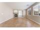 Cozy living room features recessed lighting, stone fireplace, built-in shelving and large windows at 4133 Perfect Lure St, Las Vegas, NV 89129