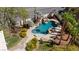 Aerial view of a backyard pool with a waterfall and lush, mature landscaping at 4200 Topsider St, Las Vegas, NV 89129