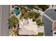 Aerial view of beautiful home with a private pool, lush landscaping, and solar panels at 4200 Topsider St, Las Vegas, NV 89129