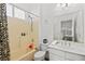 Tiled bathroom with a shower-tub combo and a single sink vanity at 4200 Topsider St, Las Vegas, NV 89129