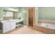 Bathroom with a soaking tub, walk-in shower, and modern vanity at 4200 Topsider St, Las Vegas, NV 89129