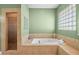 Well-lit bathroom features a soaking tub and walk-in shower at 4200 Topsider St, Las Vegas, NV 89129