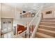 Bright foyer with staircase leading to the second floor and chandelier lighting at 4200 Topsider St, Las Vegas, NV 89129