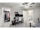 Bedroom with a ceiling fan with connected closet and bathroom at 4220 Porticella Ave, North Las Vegas, NV 89084